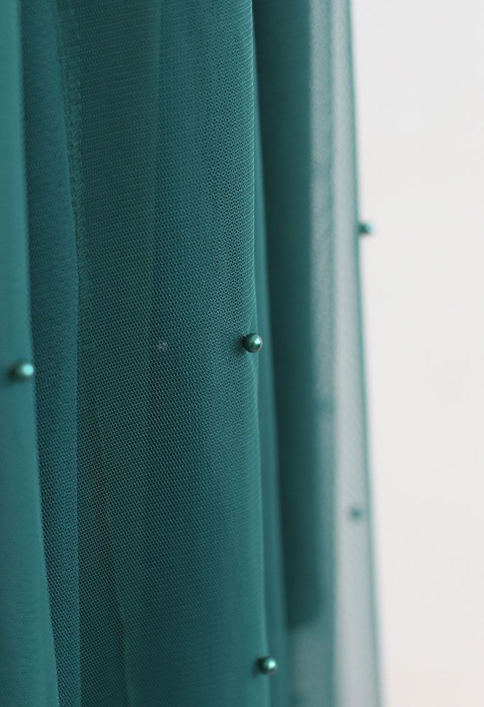 تنورة شبكية من التول مزينة باللؤلؤ باللون الأخضر