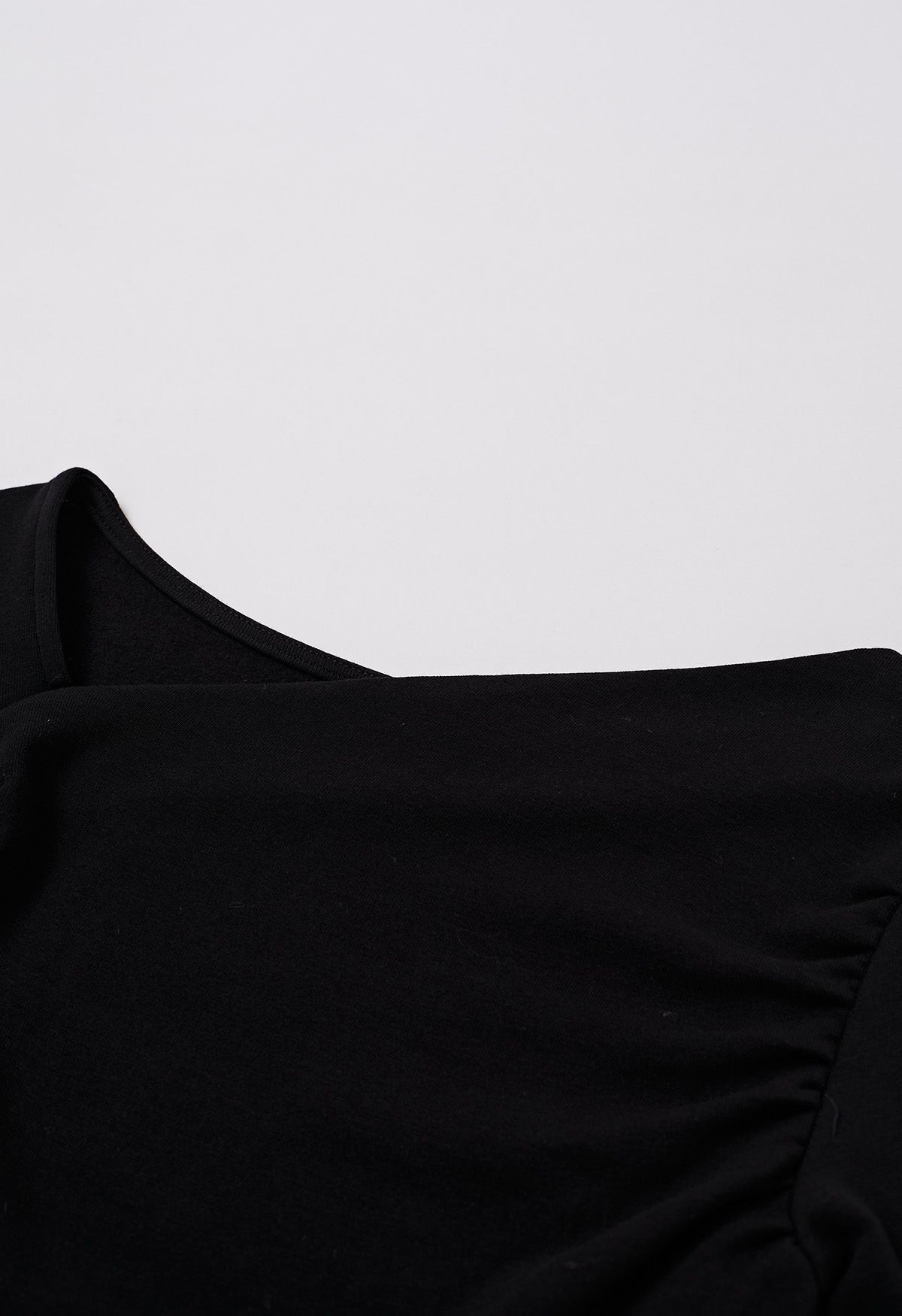 Asymmetric Neck Ruched Long Sleeve Top in Black