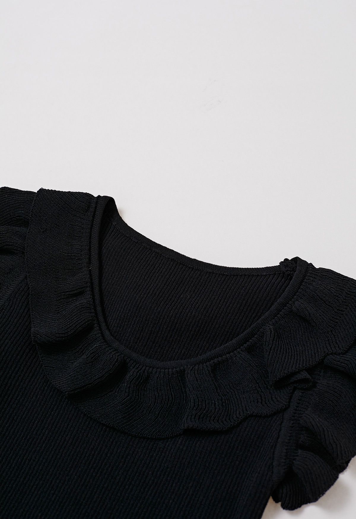 Ethereal Ruffle Sleeveless Knit Top in Black