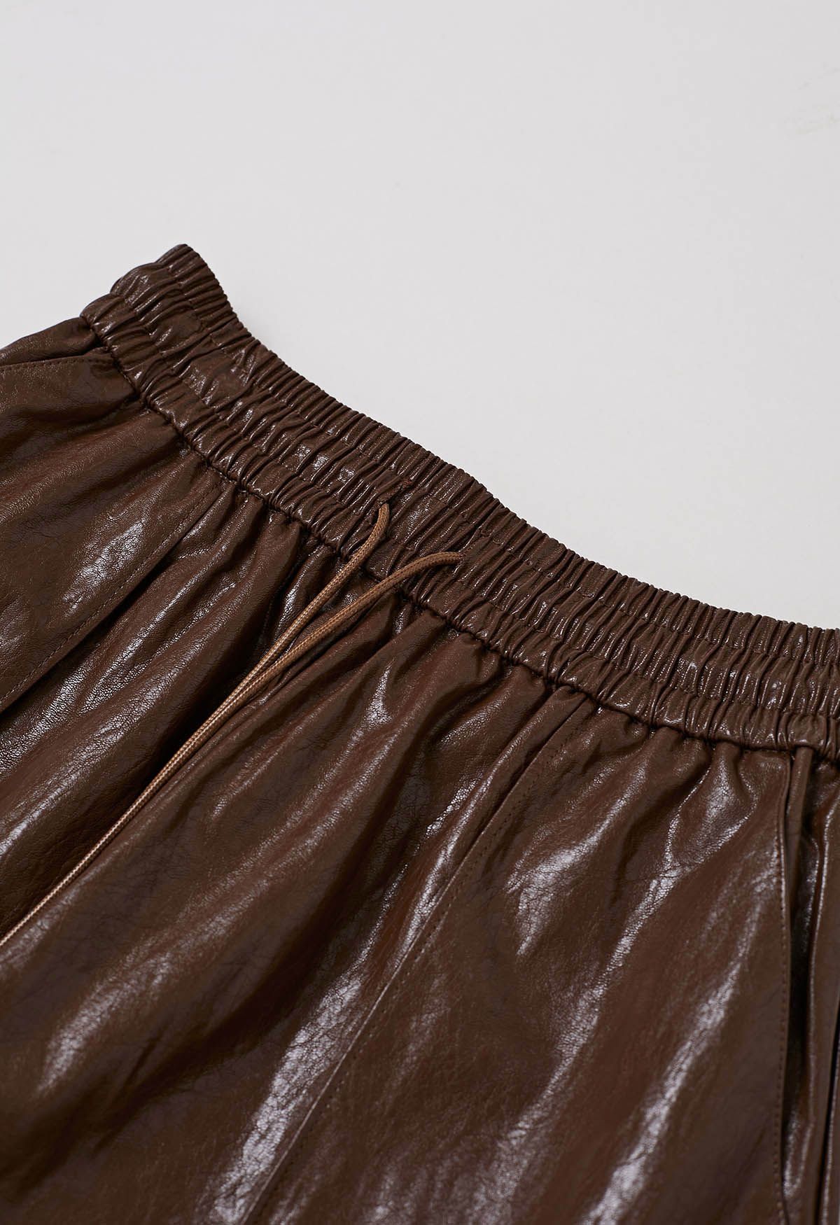 Urban Chic Faux Leather Drawstring Shorts in Brown