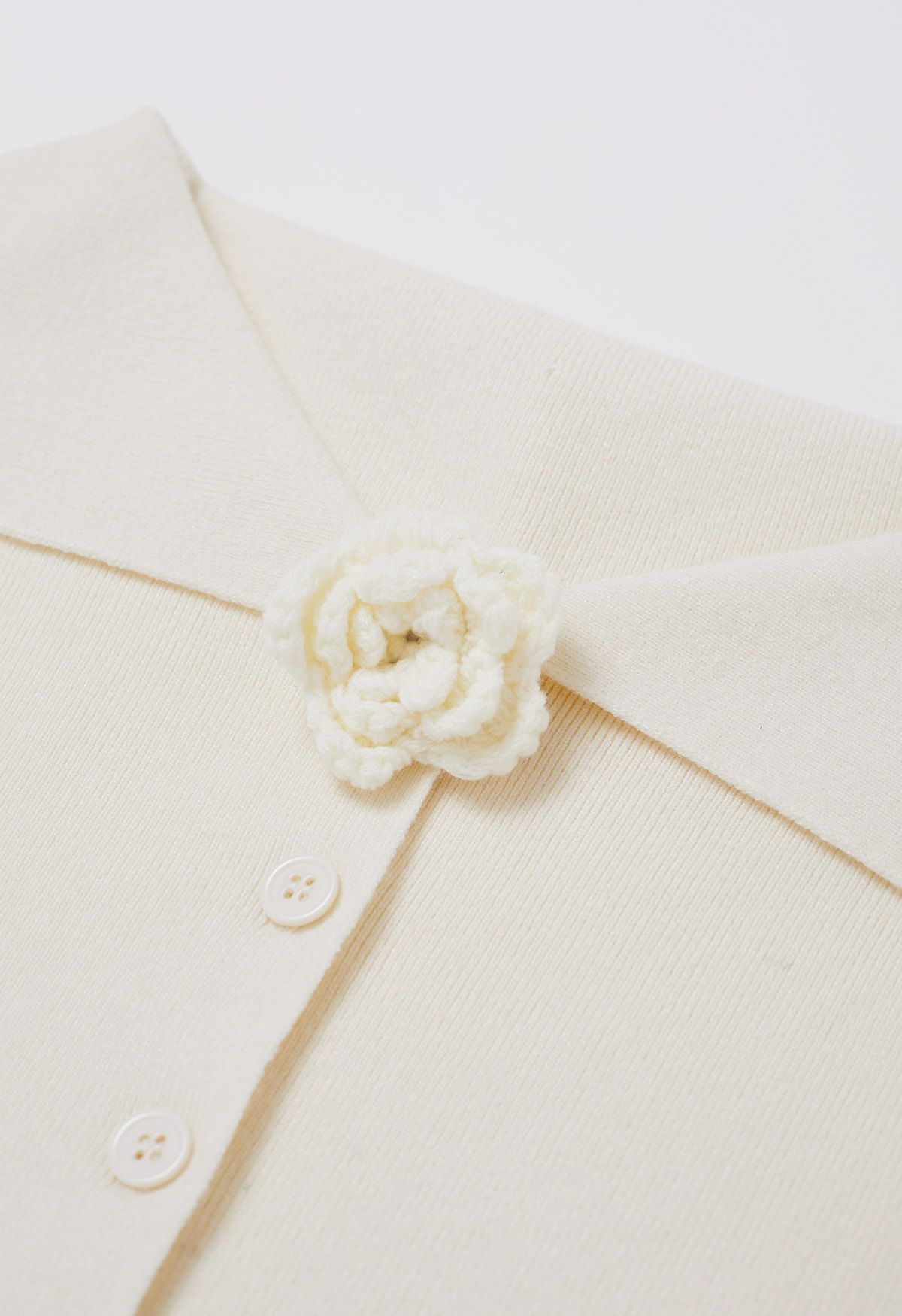 Floral Brooch Off-Shoulder Buttoned Knit Top in Cream